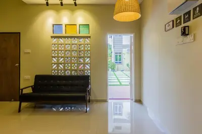 a living room with a couch and a window at Newly 4BR Cottage House Retreats with Free Parking in Butterworth