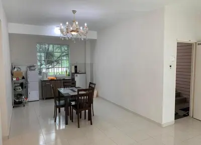 a dining room and kitchen with a table and chairs at The Trails Kampar in Kampong Malim Nawar