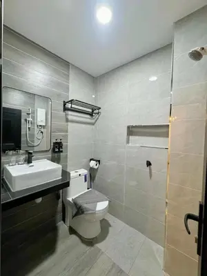 a bathroom with a toilet and a sink and a shower at 82,Dream Guest House in Tanjung Piandang