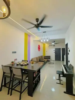 a living room with a table and a couch at 82,Dream Guest House in Tanjung Piandang