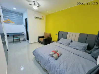 a bedroom with a bed with a teddy bear on it at 82,Dream Guest House in Tanjung Piandang