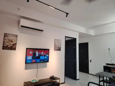 a living room with a flat screen tv on the wall at View of the whole Georgetown in George Town