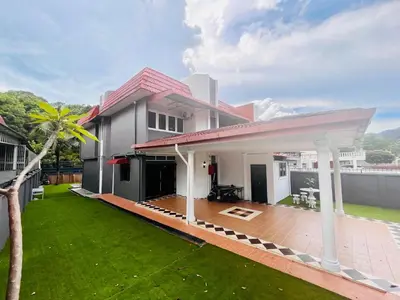 a house with a patio and a yard at Nature Surrounded Riverside Villa with BBQ ,& SWIMMING POOL in George Town
