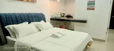 a white bed with white pillows in a room at RJ Studio 1 - Kompleks Mutiara in Gua Musang