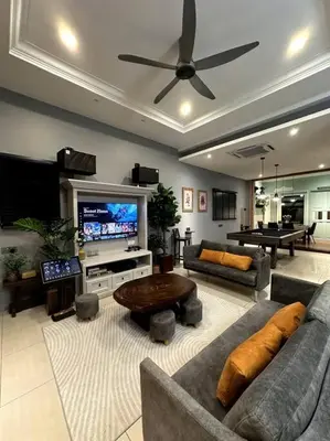 a living room with couches and a flat screen tv at YouLuvHomestay 4BR for 16-18 Pax Gunung Rapat Ipoh in Ipoh