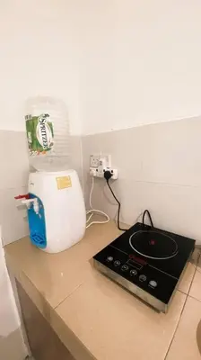 a kitchen counter with a blender on top of it at R&R Manjung Guest House at Pangsapuri Samudera in Seri Manjung