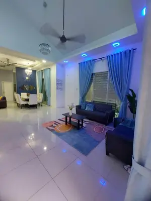 a living room with a couch and a table at Puteri Homestay Sg Petani in Sungai Petani