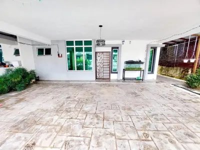 an empty room with a stone floor in a house at Puteri Homestay Sg Petani in Sungai Petani