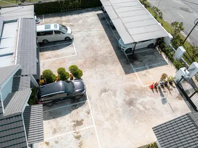 an overhead view of a truck parked in a parking lot at The Farmhouse in Ipoh