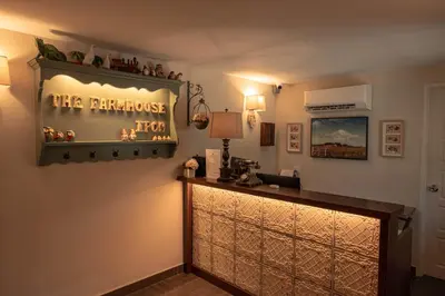 a bar in a room with a sign on the wall at The Farmhouse in Ipoh