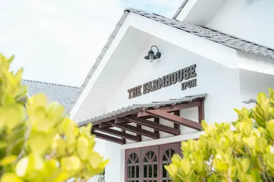 a sign on the side of a building at The Farmhouse in Ipoh