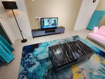 a living room with a laptop on a table at Pavilionvillie M1T696 by irainbow in Ipoh