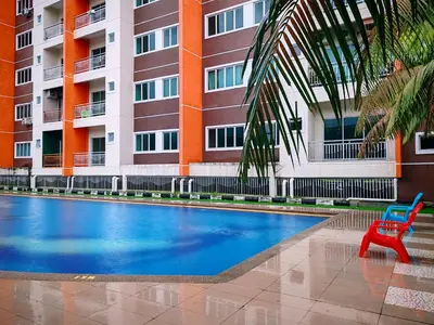a red chair sitting in front of a building at Pavilionvillie M1T686 by irainbow in Ipoh