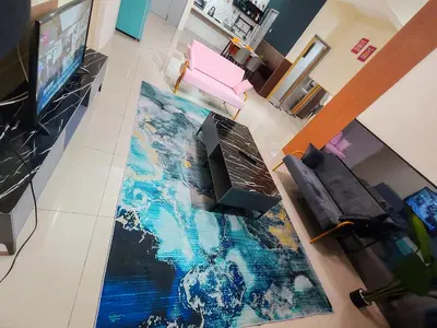 an aerial view of a living room with a television and a carpet at Pavilionvillie M1T686 by irainbow in Ipoh