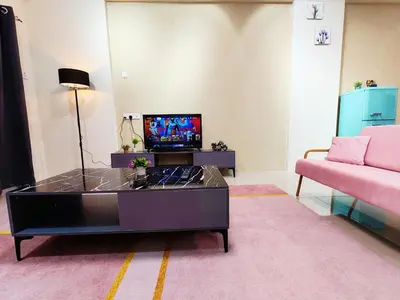 a living room with a tv and a coffee table at Pavilionvillie M1T695 by irainbow in Ipoh