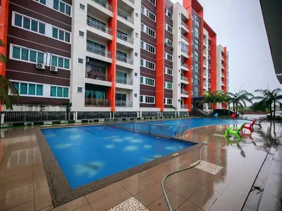 a swimming pool in front of a building at Pavilionvillie M1T695 by irainbow in Ipoh