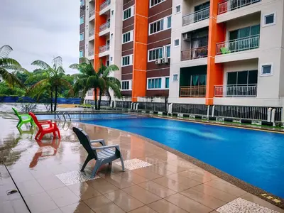a swimming pool in front of a building at Pavilionvillie M1T695 by irainbow in Ipoh