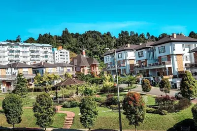 a group of apartment buildings in a park at Zinnia Residence in Tanah Rata
