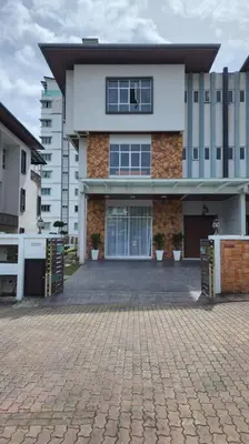 a building with a brick driveway in front of it at Zinnia Residence in Tanah Rata
