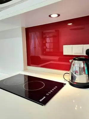 a kitchen with a toaster and a tea kettle on a counter at Modern Suite in Penang Island in Jelutong