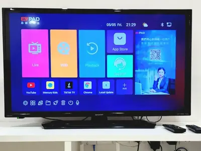 a flat screen tv sitting on top of a table at Modern Suite in Penang Island in Jelutong