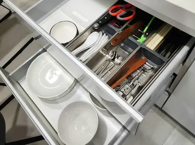 a metal shelf with dishes and scissors in a kitchen at Modern Suite in Penang Island in Jelutong