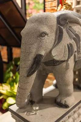 a statue of an elephant standing on a table at Sebayu Retreat Gopeng in Gopeng