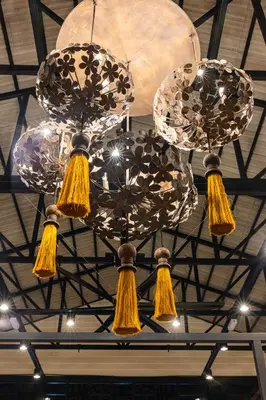 a chandelier with three lights hanging from a ceiling at Sebayu Retreat Gopeng in Gopeng