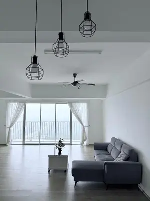 a living room with a couch and a ceiling fan at The Ximplicity @ Venus Residence Sitiawan Manjung in Sitiawan