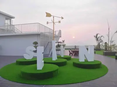 a large sign that says sit on a green lawn at The Ximplicity @ Venus Residence Sitiawan Manjung in Sitiawan