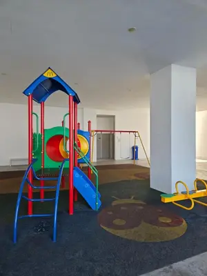 a play room with a playground with a slide at Metropol Serviced Apartment Bukit Mertajam Perda in Bukit Mertajam