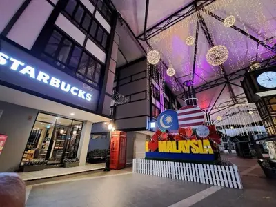 a store front of a shopping center with a clock at ALEESYA Homestay at Emerald Avenue Brinchang in Brinchang