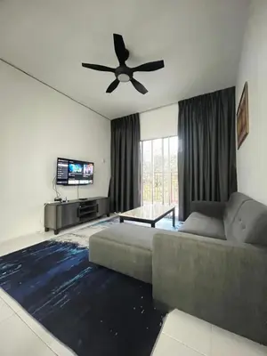 a living room with a couch and a ceiling fan at ALEESYA Homestay at Emerald Avenue Brinchang in Brinchang
