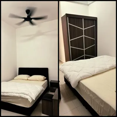 a bedroom with a bed and a ceiling fan at Prima Falim in Ipoh