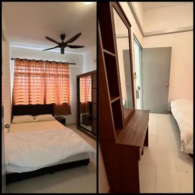 a bedroom with a bed and a mirror at Prima Falim in Ipoh