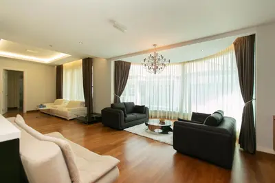 a living room with two couches and a chandelier at Tanjung Bungah 5BR 18 Bungalow KTV in Tanjung Bungah
