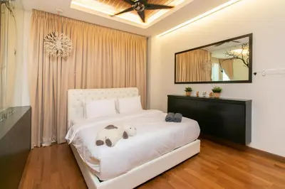 a bedroom with a white bed with a large mirror at Tanjung Bungah 5BR 18 Bungalow KTV in Tanjung Bungah
