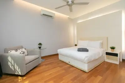 a white bedroom with a bed and a couch at Tanjung Bungah 5BR 18 Bungalow KTV in Tanjung Bungah