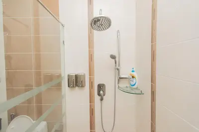 a bathroom with a shower with a shower head at Tanjung Bungah 5BR 18 Bungalow KTV in Tanjung Bungah