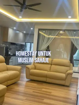 a living room with a couch in front of a window at Adik aisyah teres golden hill Cameron Highlands in Brinchang