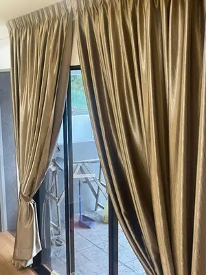 a curtain in front of a room with a table at Adik aisyah teres golden hill Cameron Highlands in Brinchang