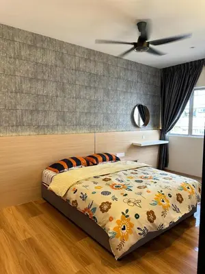 a bedroom with a bed and a ceiling fan at Adik Aisyah Muji Homestay Cameron Highlands N in Cameron Highlands