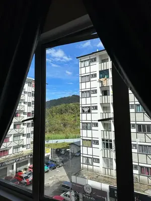 a view of a building from a window at Adik Aisyah Muji Homestay Cameron Highlands N in Cameron Highlands