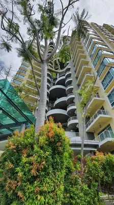a building with cars parked in front of it at Sky Residence -3 Bedrooms Condo at Cinta Sayang, Sungai Petani in Sungai Petani