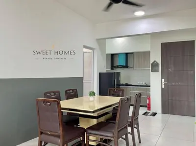a kitchen with a dining room table and chairs at CozySuite3R2B#5mintoPenangBridge in Perai