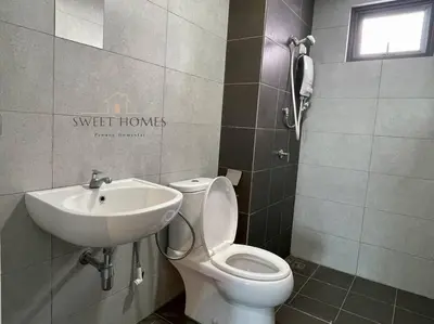 a bathroom with a toilet and a sink at CozySuite3R2B#5mintoPenangBridge in Perai