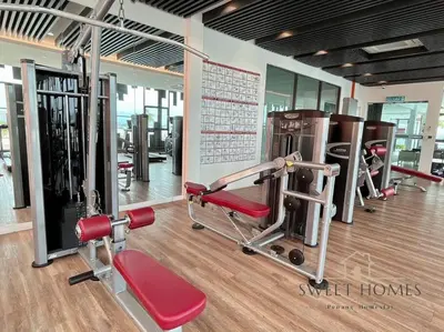 a gym with several treadmills and machines in it at CozySuite3R2B#5mintoPenangBridge in Perai