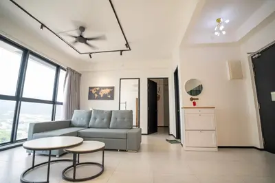 a living room with a couch and a table at Seaview Urban suites Georgetown @Penang in Jelutong