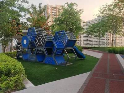 a playground in a park with blue play equipment at Seaview Urban suites Georgetown @Penang in Jelutong