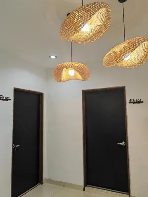two doors in a room with two lights at Padang Serai Cozy Roomstay Share Bathroom in Padang Serai